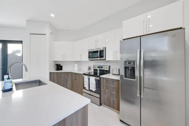 a view of living room with granite countertop furniture and a flat screen tv