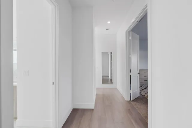 a bedroom with a large bed and a dresser