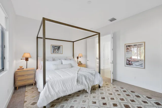 a large bathroom with a tub a sink and mirror