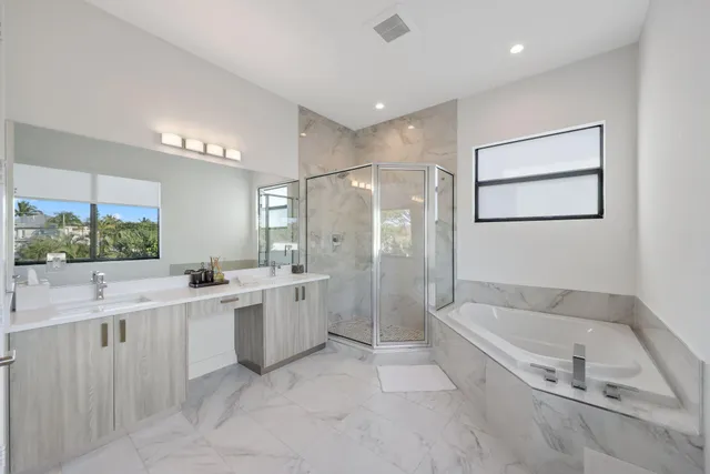 a bathroom with a double vanity sink mirror and double
