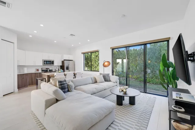 a view of a dining room with furniture and window