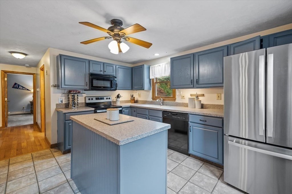 5 Stacey Road Middleboro, MA 02346 - Photo 22 of 40 a kitchen with kitchen island granite countertop stainless steel appliances cabinets a sink and a counter top space