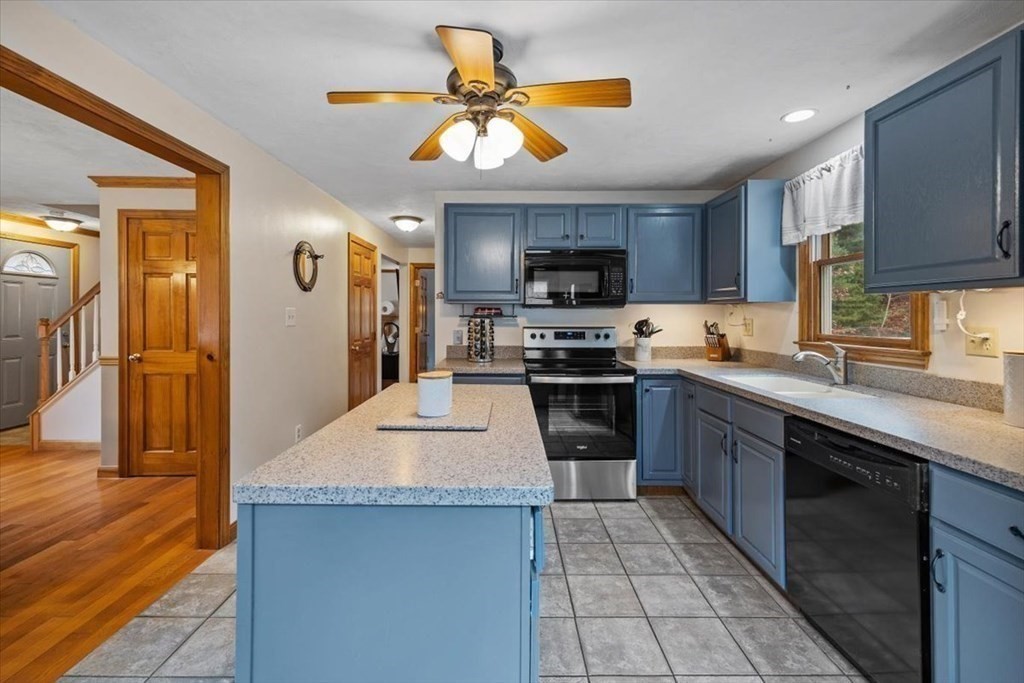 5 Stacey Road Middleboro, MA 02346 - Photo 23 of 40 a kitchen with kitchen island granite countertop a sink appliances cabinets and a counter top space
