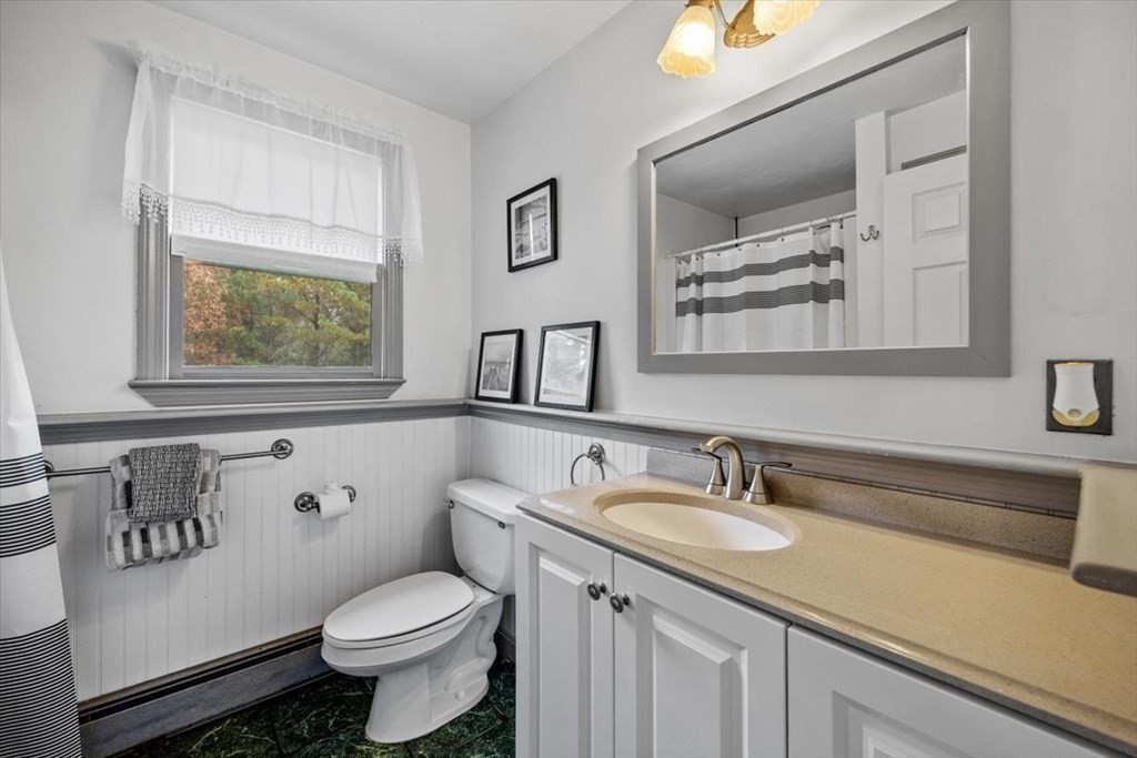 5 Stacey Road Middleboro, MA 02346 - Photo 26 of 40 a bathroom with a granite countertop sink mirror vanity and toilet