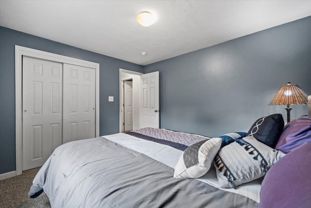 5 Stacey Road Middleboro, MA 02346 - Photo 33 of 40 a bedroom with a bed and a lamp