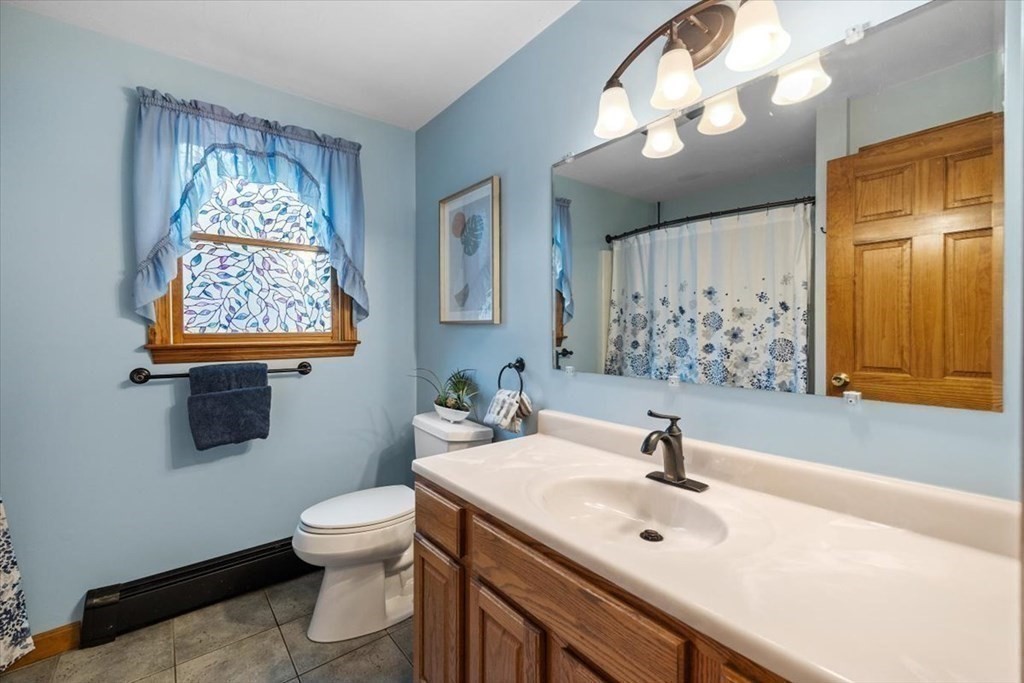 5 Stacey Road Middleboro, MA 02346 - Photo 35 of 40 a bathroom with a sink a toilet and mirror