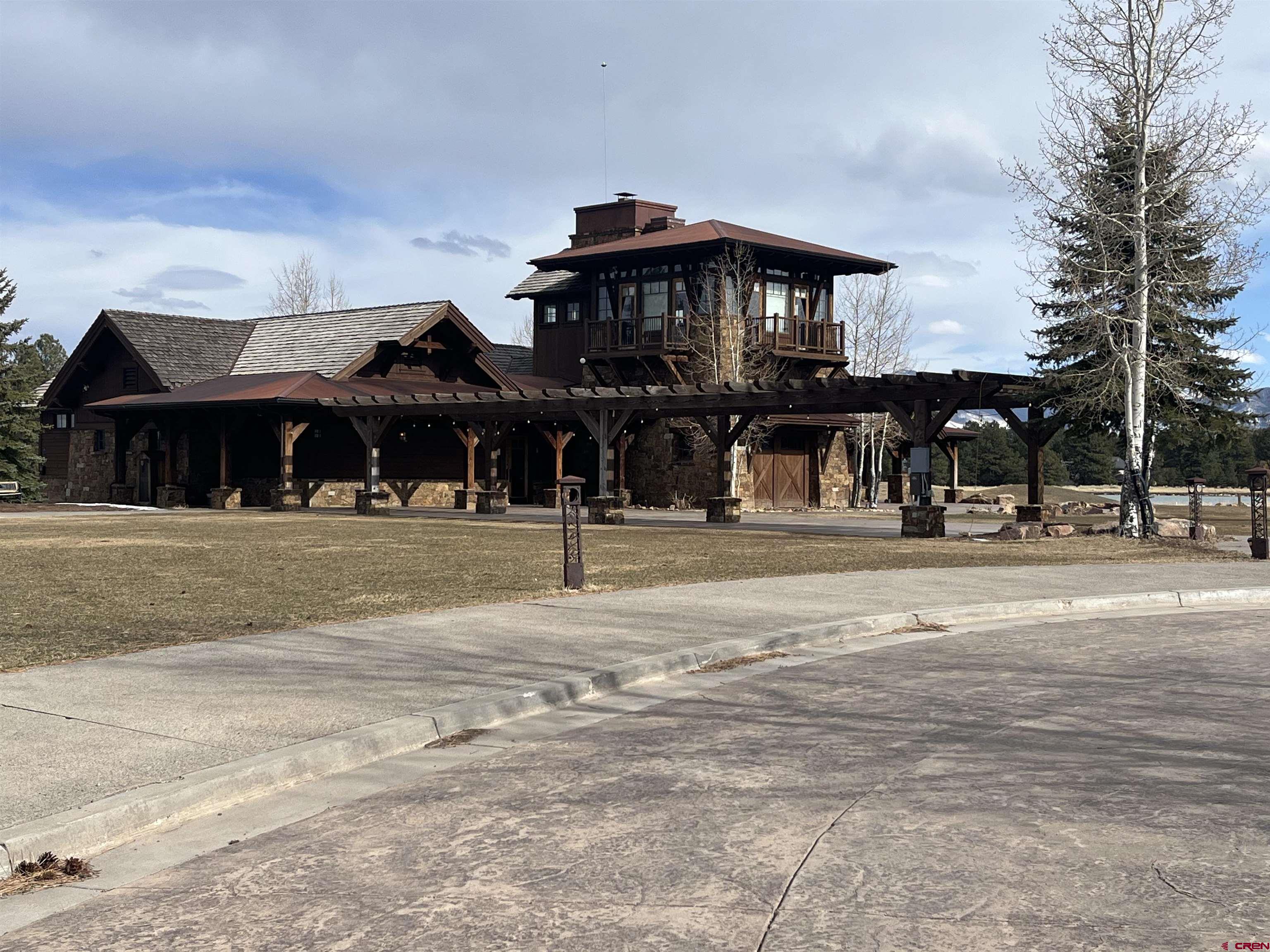 Tbd Tbd Badger Trail Ridgway, CO 81432 - Photo 6 of 6 a front view of a house and a yard