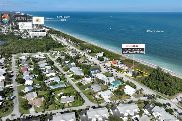 an aerial view of houses with outdoor space