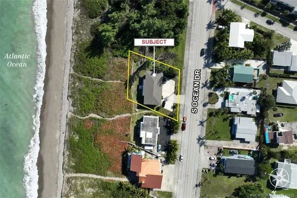 an aerial view of houses with outdoor space