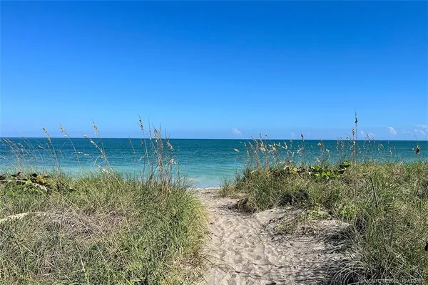 a view of a water with a beach