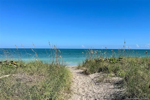 a view of a water with a beach