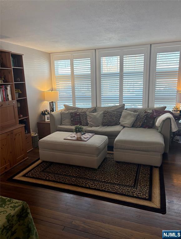 66 Stuart Street, Unit A Waldwick, NJ 07463 - Photo 2 of 6 a living room with furniture and a floor to ceiling window