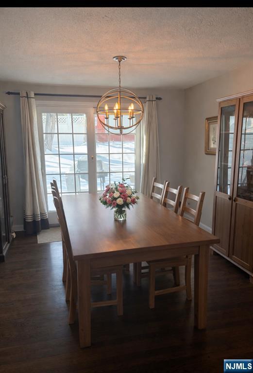 66 Stuart Street, Unit A Waldwick, NJ 07463 - Photo 5 of 6 a view of a dining room with furniture window and wooden floor