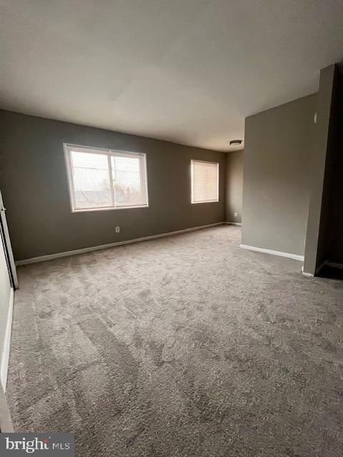 4757 South Capitol Terrace Southwest Washington, DC 20032 - Photo 11 of 18 an empty room with windows and entrance