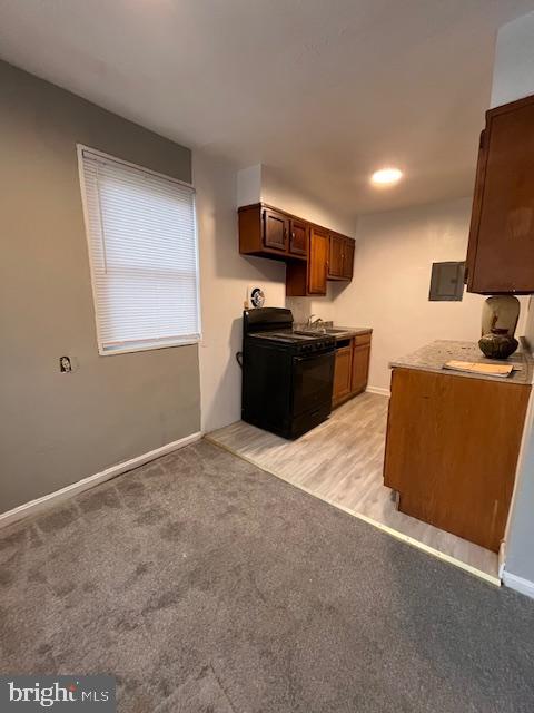 4757 South Capitol Terrace Southwest Washington, DC 20032 - Photo 14 of 18 a kitchen with stainless steel appliances granite countertop a stove a sink and a refrigerator