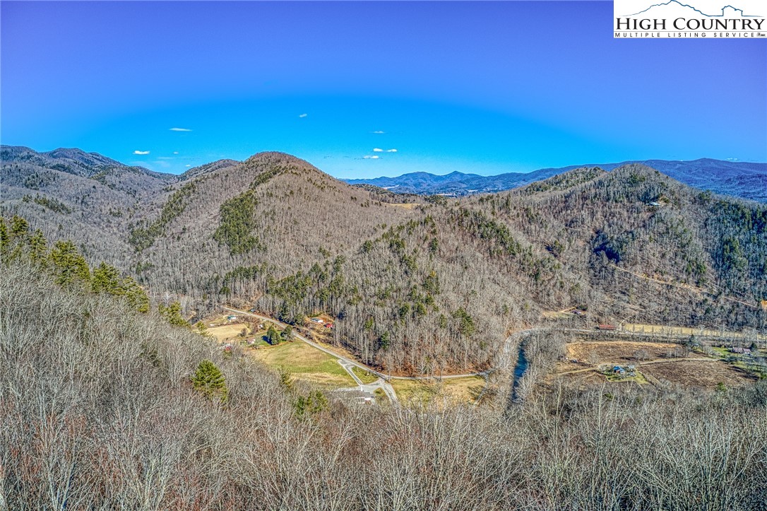 Lot 32 Sunset Ridge Butler, TN 37640 - Photo 14 of 17 a view of a dry yard with mountains in the background