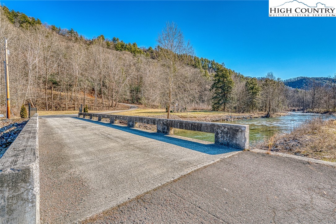 Lot 32 Sunset Ridge Butler, TN 37640 - Photo 10 of 17 a view of a swimming pool with an outdoor seating and a view of mountains
