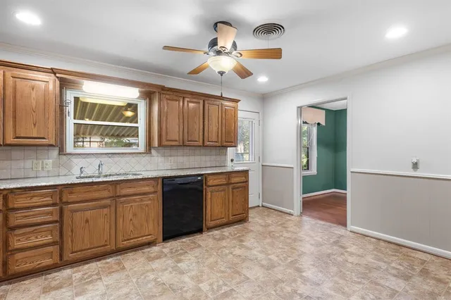 a kitchen with a sink stove and refrigerator