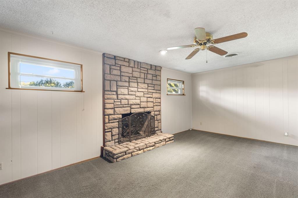 4906 Greenbriar Road Wichita Falls, TX 76302 - Photo 14 of 33 a view of an empty room with a fireplace