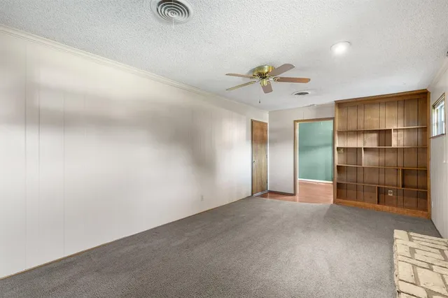 an empty room with closet and cabinet