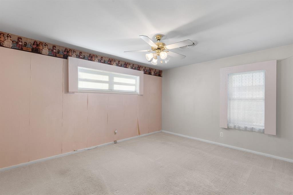 4906 Greenbriar Road Wichita Falls, TX 76302 - Photo 27 of 33 an empty room with windows and fan