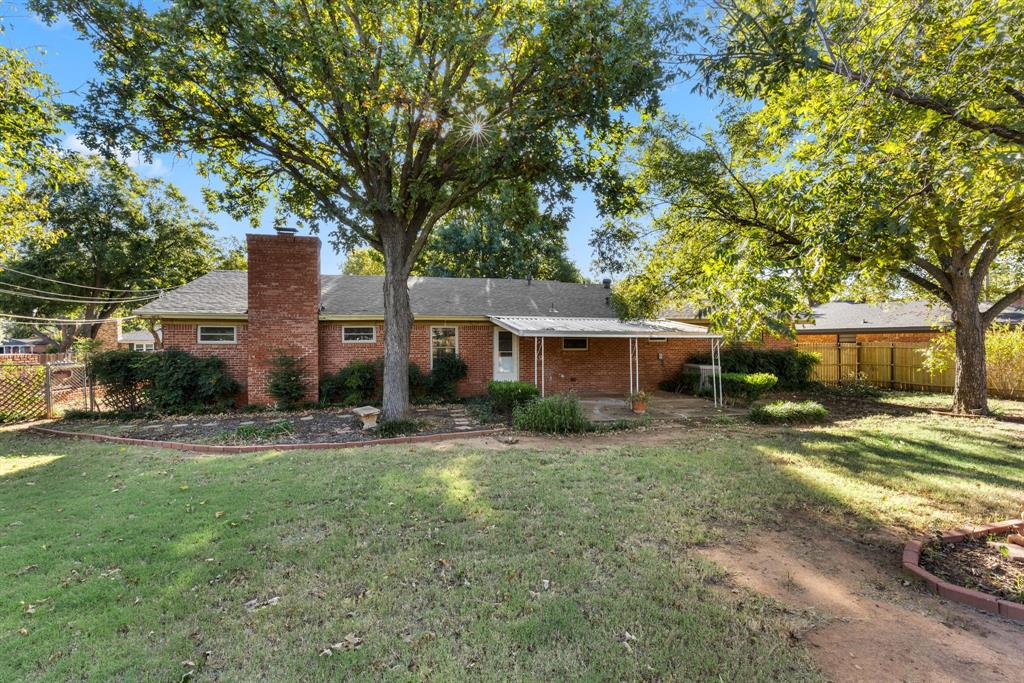 4906 Greenbriar Road Wichita Falls, TX 76302 - Photo 30 of 33 a view of a yard in front of a house with large trees