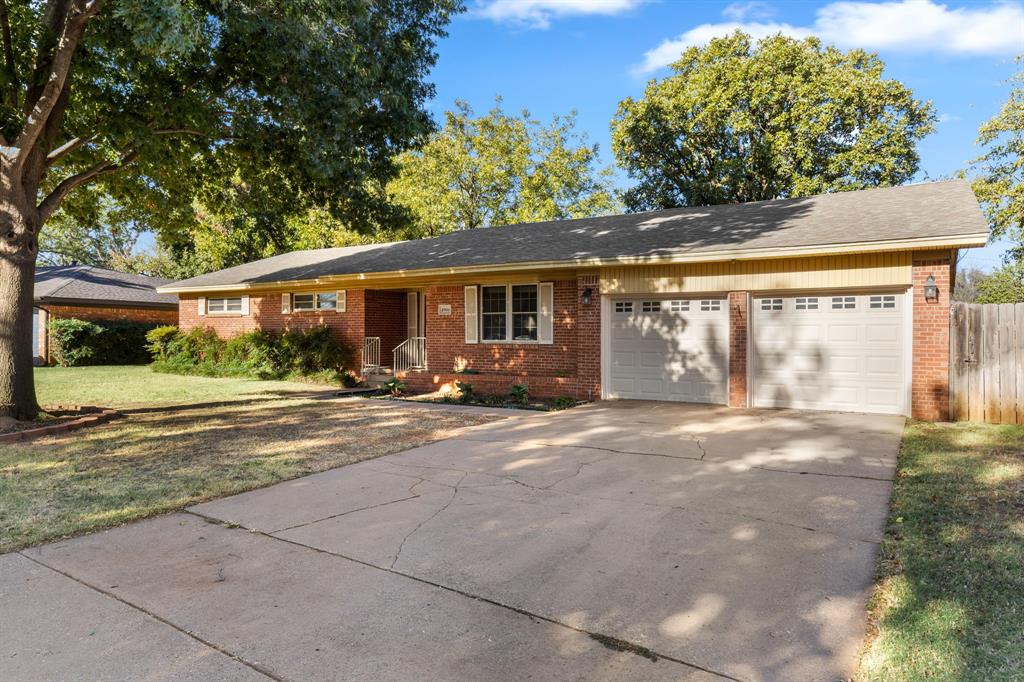 4906 Greenbriar Road Wichita Falls, TX 76302 - Photo 3 of 33 a view of the house with backyard and porch