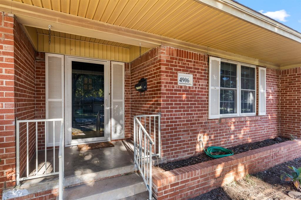 4906 Greenbriar Road Wichita Falls, TX 76302 - Photo 4 of 33 a front view of a house with a tree