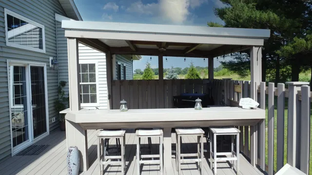 an aerial view of a house with outdoor space lake lake and outdoor seating