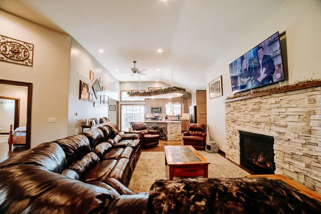 a kitchen with stainless steel appliances granite countertop a sink stove and cabinets