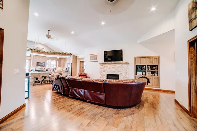a view of a dining room with furniture and wooden floor