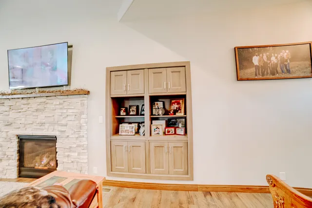 a view of a dining room with furniture wooden floor and a potted plant