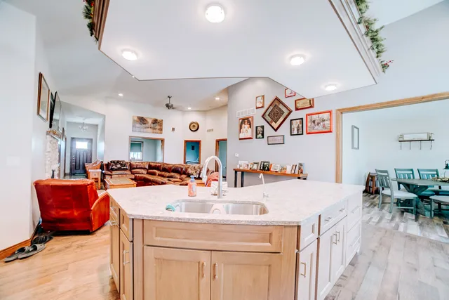 a view of a livingroom with furniture and a flat screen tv
