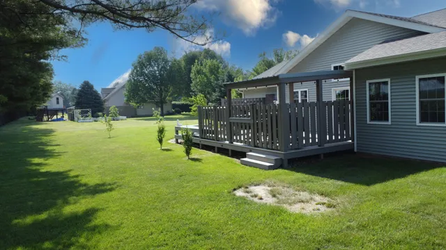 a view of balcony with furniture and wooden floors