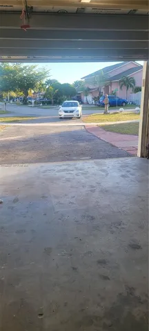 a view of a livingroom with an empty space and a window
