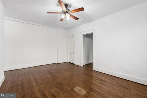 a view of room with wooden floor