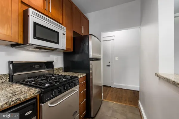 a kitchen with a stove and a microwave