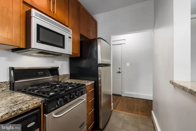 a kitchen with a stove and a microwave