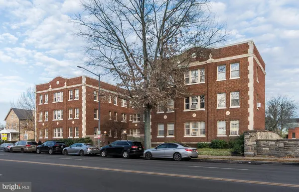 a city street lined with buildings and cars