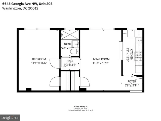 a view of room with hardwood floor and a ceiling fan
