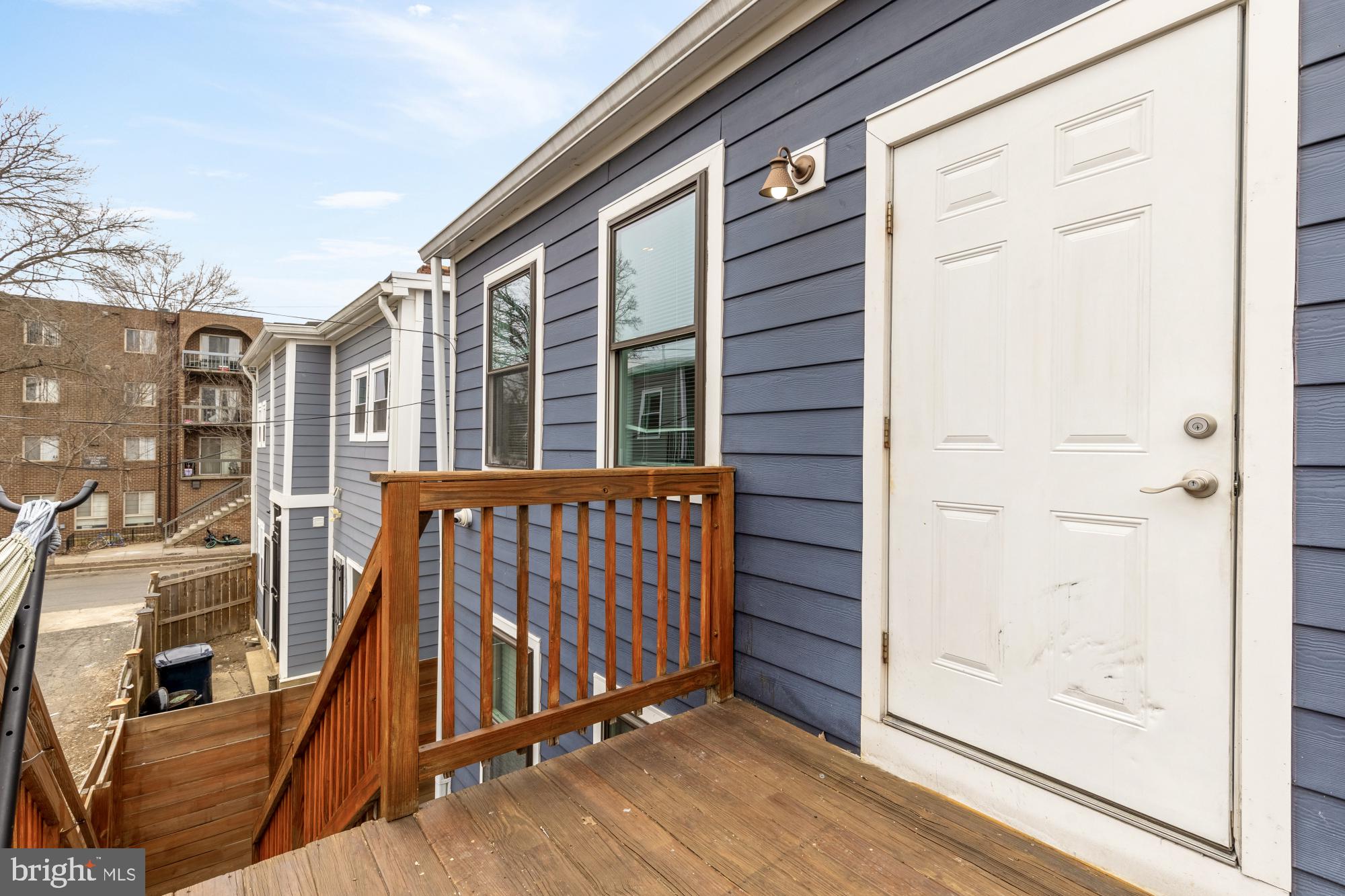 1605 F Street Northeast, Unit 4 Washington, DC 20002 - Photo 24 of 25 a view of a balcony with wooden floor and fence