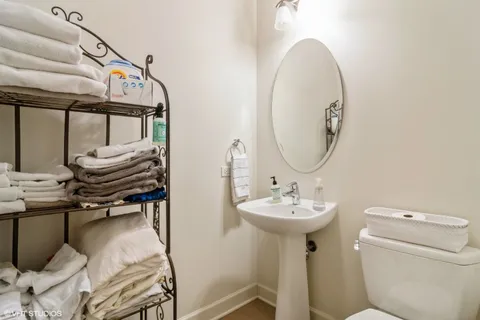 a bathroom with a sink a mirror and a toilet