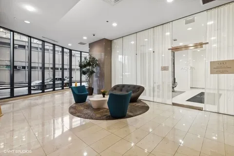 a view of a kitchen counter top a dining table and chairs