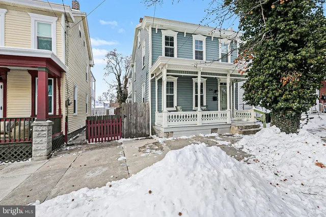 a front view of a house with a outdoor space