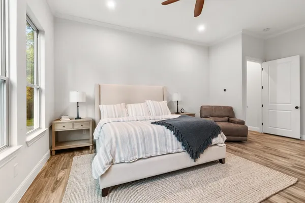 a bedroom with a bed and window