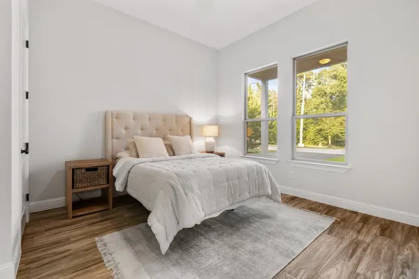a bedroom with a bed and window