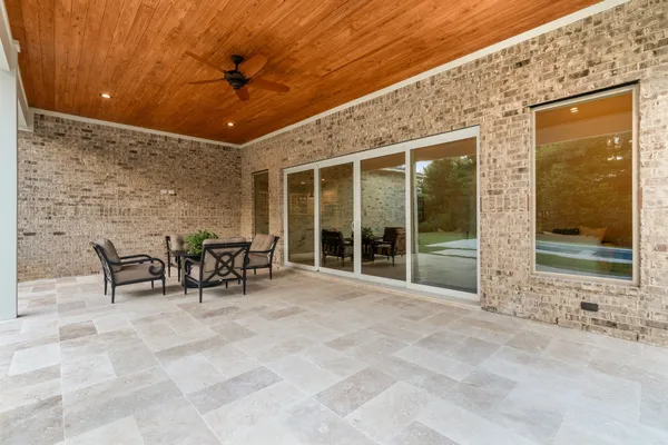 a view of a entryway with a table and chairs