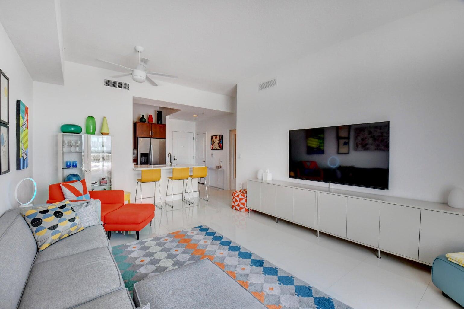 450 North Federal Highway, Unit PH03 Boynton Beach, FL 33435 - Photo 16 of 41 a living room with furniture and a flat screen tv