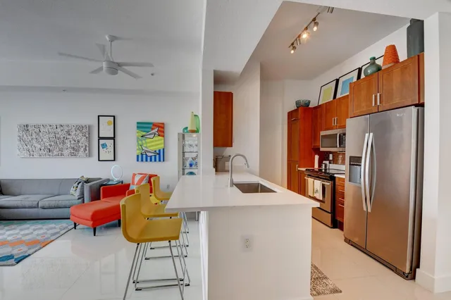 a kitchen with stainless steel appliances a refrigerator and a stove