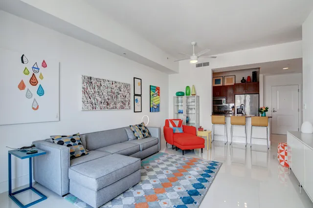 a living room with furniture and a rug